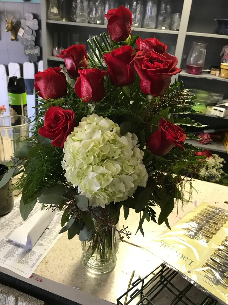 Tall red rose and hydrangea arrangement