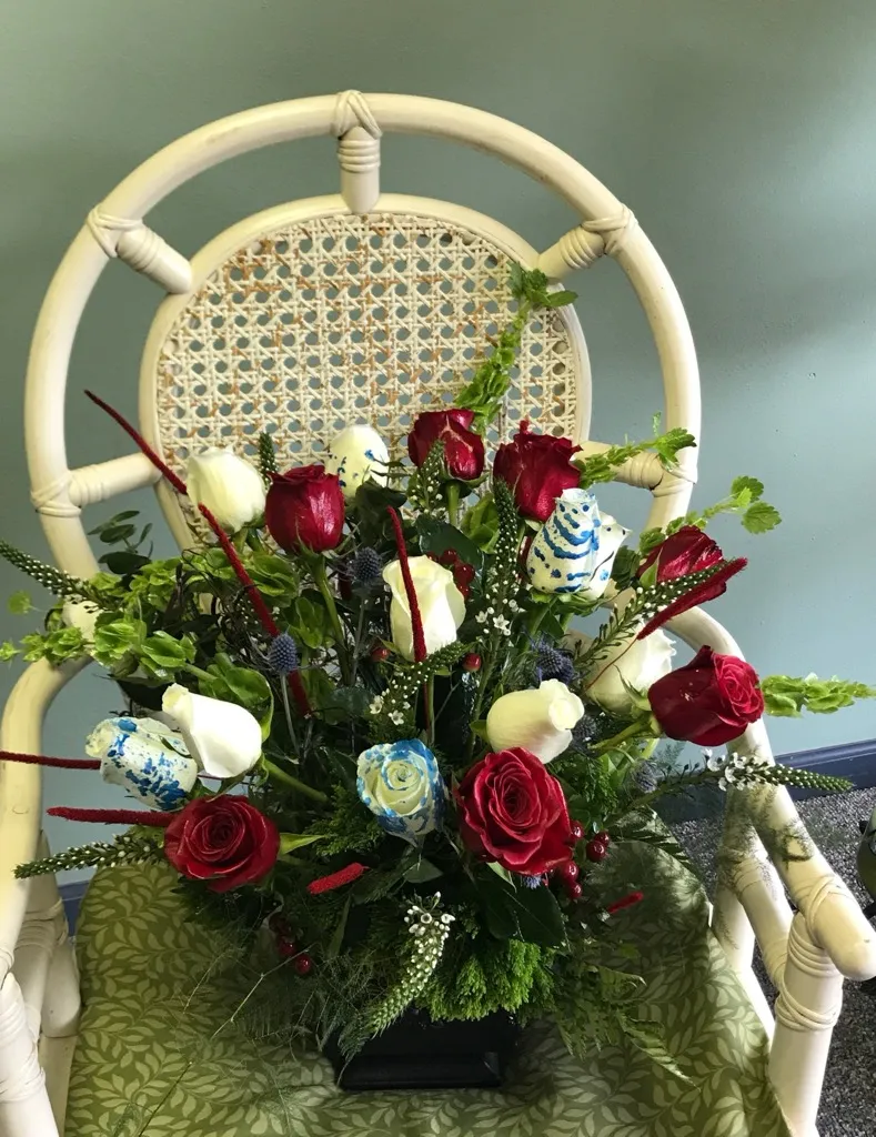 Red and white roses with blue accents