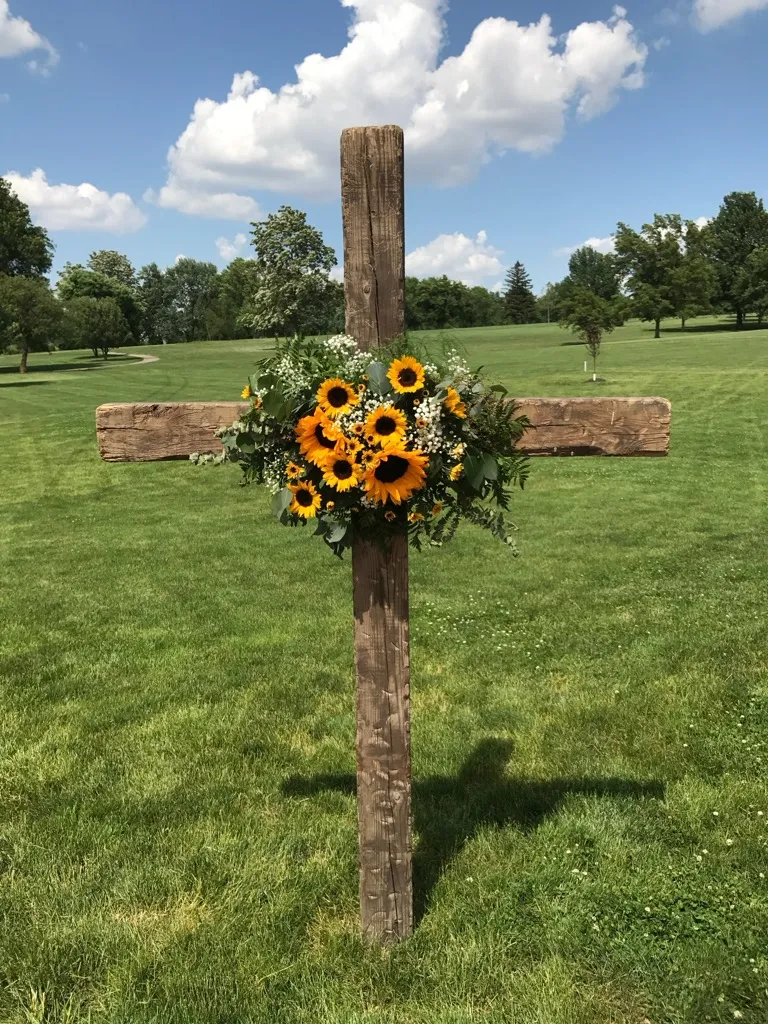 Sunflower cross tribute photographed outdoors